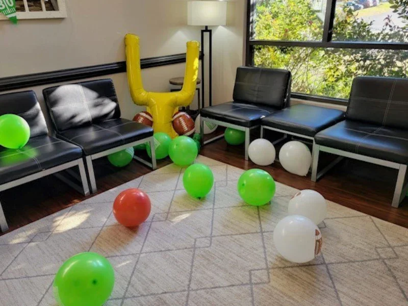 Photo of Dental Office with balloons and football crossbar inflatable