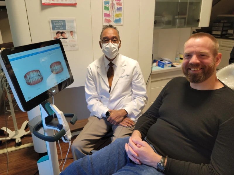 Doctor with Patient Analyzing Patients Smile