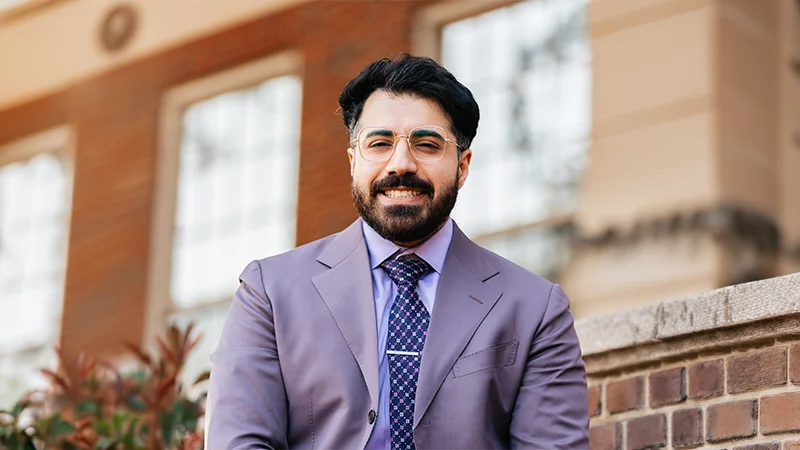Dr. Amir Maghsoudi, DDS standing outside of a building