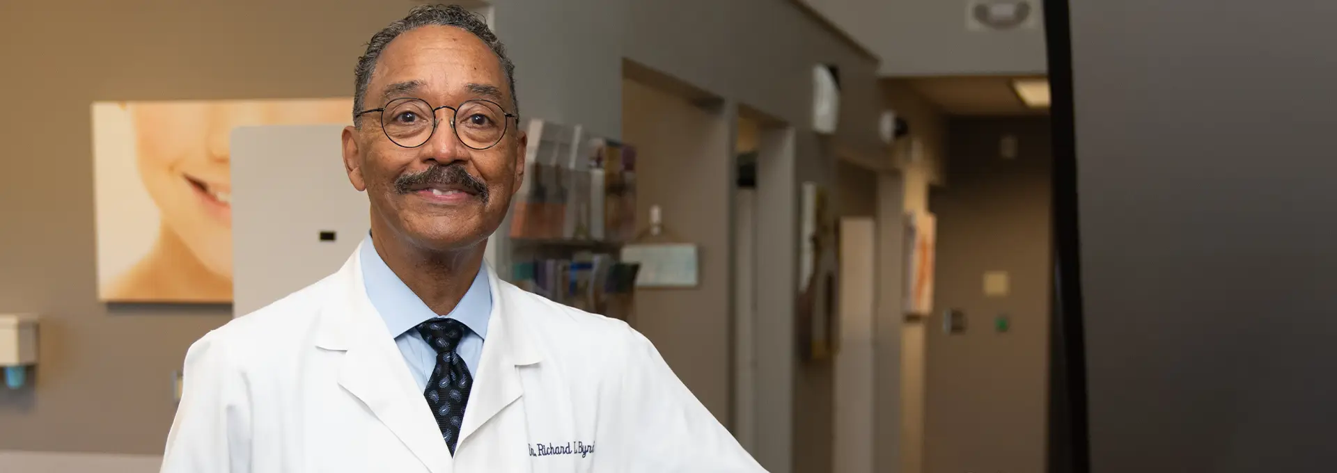 Closeup of Dr. Richard Byrd, DDS standing in office
